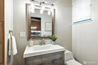 Main floor shower updated in recent times with new vanity and surround.