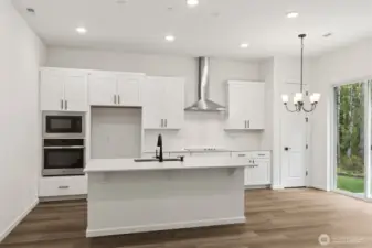 ***Actual Home *** Kitchen with large island and dining area