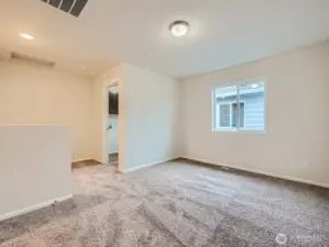 Photo is of the same model home in a different community