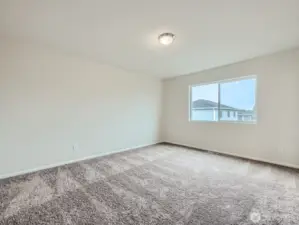 Photo is of the same model home in a different community