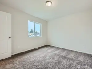 Photo is of the same model home in a different community