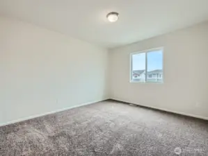 Photo is of the same model home in a different community
