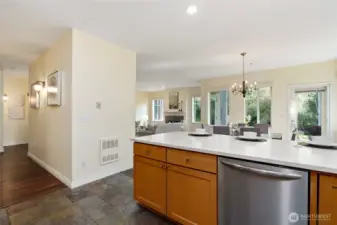 Kitchen with hallway to primary bedroom, entry and office.