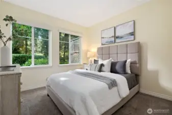 Guest bedroom with lovely landscaped view.