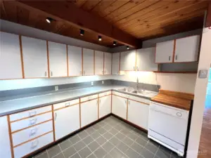 Lots of counter space in the kitchen with older appliances ready to be freshened up.