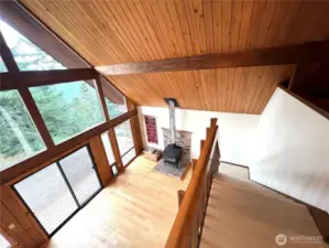 This is a wide angle view of the staircase from the SW main room to the second floor loft.