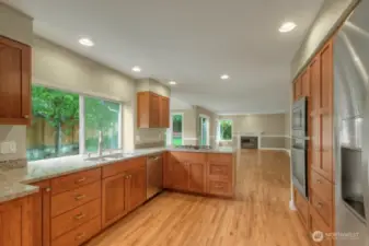 Open-concept kitchen flowing into dining and living areas