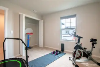 4 of 4 guest bedrooms staged as a workout room.