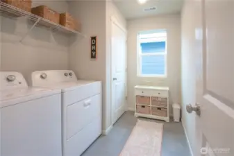 Large laundry room with window.