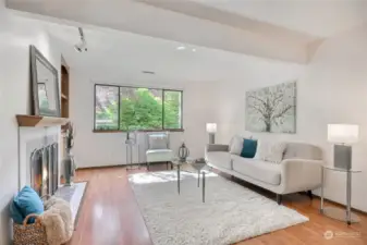 Nestled in a tranquil, treed setting, this end unit boasts a spacious living room with cozy fireplace.