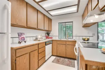 Kitchen boasts ample counter space and built-ins in the dining area for extra storage.