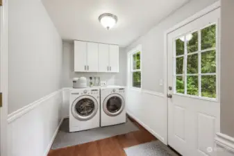 We love this laundry room which also functions as a traditional "mud room". Come in front outside and step out of your garden or play clothes so you don't bring it into the house! (Beautiful W&D are negotiable.)
