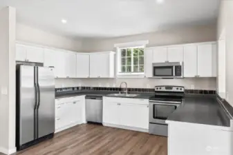 Kitchen has Stainless Steel Appliances & Granite Countertops