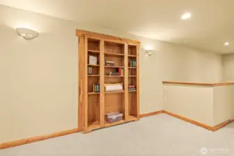 Bookcase in upstairs living room, is entrance to hidden room.
