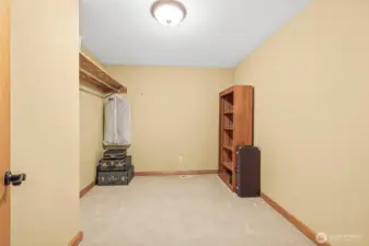 Walk-in closet for upstairs primary bedroom.