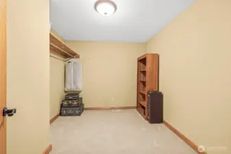 Walk-in closet for upstairs primary bedroom.