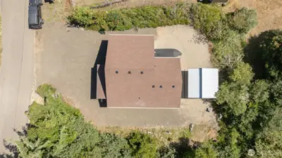 Drone over property. The bushes are part of this lot. They did not clear the entire property the kept bushes for privacy.