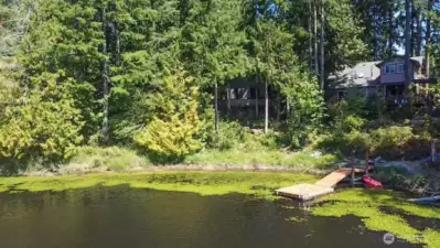Drone view of the house from the lake.  Deck on lake belongs to the neighboring house to the right.