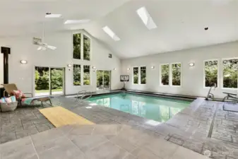 Landing to atrium and pool room! Features gas fireplace for warming your winter days! Pool is solar-heated and has electronic cover.