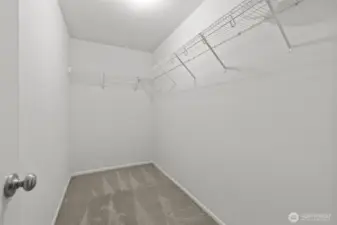 Primary bedroom walk-in closet