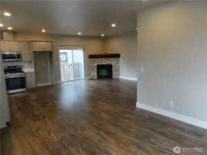 Entry. One can see the open concept of kitchen and living room.