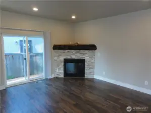 Nice living room with gas fireplace. Slider leads to deck.