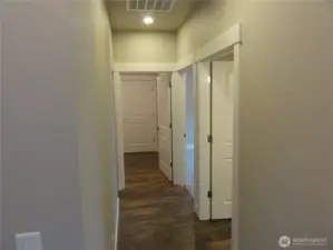 Hallway to bedrooms and garage.