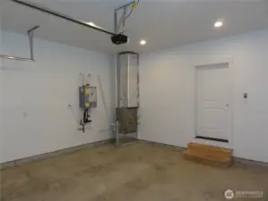 Interior garage with tankless water heater.