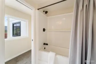 One of the two full baths, meticulously designed and equipped with modern fixtures and amenities