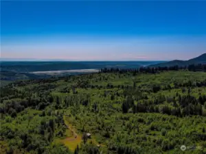 Quilcene and Quilcene Bay are just a few miles away for stores and Hood Canal access. The Cascade Mtn range in the distance can be seen from several sites on the property.