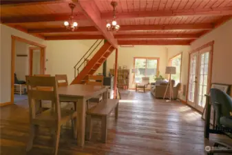 Timberframe design with rustic hand hewn hardwood flooring.