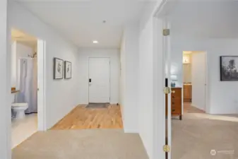 Wide hallway and double doors to primary suite expand the space