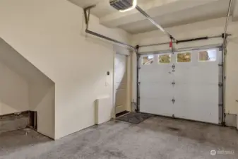 garage interior, entry door leads upstairs to main floor