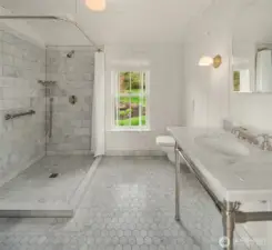 This beautifully appointed bathroom features luxurious details, perfectly complementing the downstairs flex room.