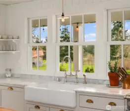Enjoy breathtaking territorial views through large windows overlooking the yard and fruit trees.