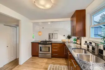 Kitchen with family room and dining area beyond.