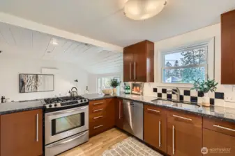 More kitchen with family/dining area beyond.