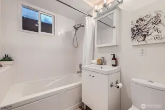 Lower level full bath adjacent to the 4th bedroom and family room. Heated Flooring!
