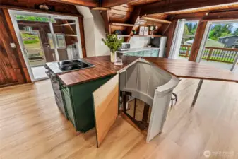 Island opens to spiral staircase descending to basement