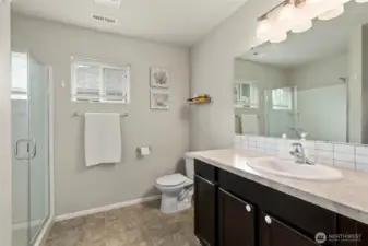 Beautiful primary bath is light and bright….