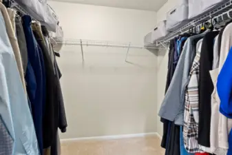 The primary walk-in closet has plenty of room for equal division. No argument here:)