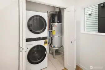 Home is equipped with a stacking washer/dryer.