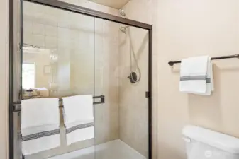 Tiled separate walk-in shower.