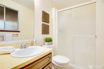 Along with this private 3/4 bath in the primary, there's a full bath in the hall, and a 2nd 3/4 bath downstairs.