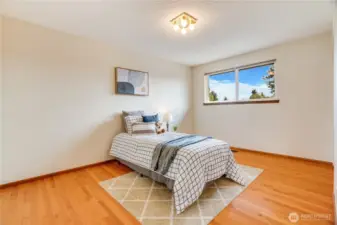 Oak floors continue into this 3rd bedroom at the end of the hall.