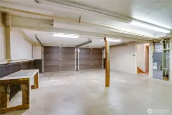 Along with room for parking, there's space for setting up a workshop in this garage, and it's also where you'll find the water heater, gas furnace, and updated electrical panel. A door at the back of the garage opens into the storage room.
