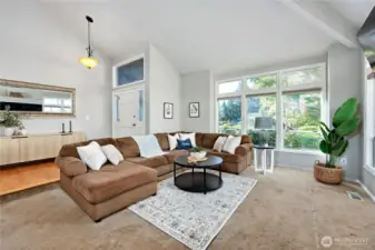 Light and bright entryway with vaulted ceilings and abundant natural light.