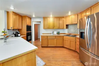 Kitchen features abundant storage and counter space.