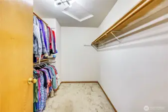 Walk in closet in primary suite.