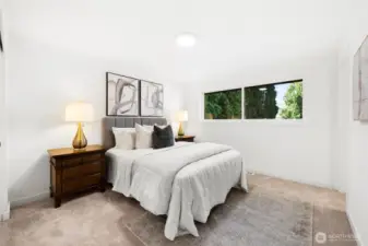 Primary bedroom boasts new carpet and attached primary bath